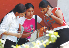 DU aspirants taking a close look at a prospectus.