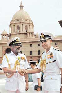 Chief of Navy Staff Admiral Arun Prakash with his Sri Lankan counterpart Vice-Admiral Daya Sandagiri on his arrival at South Block in New Delhi on Monday. 