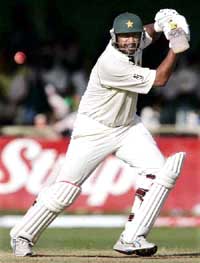 Pakistan captain Inzamam-ul-Haq plays a drive off West Indies fast bowler Daren Powell on the third day of the second and final Test at Sabina Park in Kingston, Jamaica