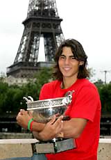 Spains Rafael Nadal with the French Open trophy during a photo call in Paris