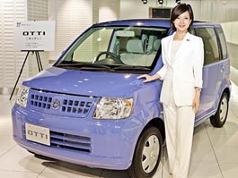 Japans auto giant Nissan unveils mini-car Otti, equipped with a 660cc turbo-charged or normal aspiration engine on its box-styled body, at the companys headquarters in Tokyo on Tuesday.