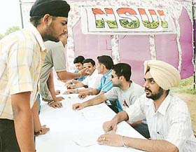 Students getting information at a guidance camp organised by the NSUI at Panjab University