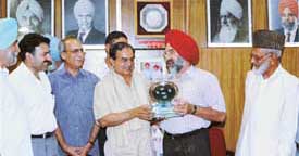 The PAU Vice-Chancellor, Dr K.S. Aulakh, presents a memento to Dr Bashir Ahmad, Vice-Chancellor, Univesity of Agriculture, Faislabad, Pakistan, on the PAU campus on Tuesday