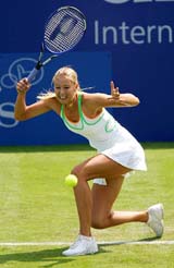 Maria Sharapova of Russia plays a shot during her match against Anne Kremer of Luxemburg in the second round of the Edgbaston grasscourt championships near Birmingham