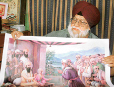 Artist Satpal Danish displays a fresco painting of G.S. Sohan Singh.
