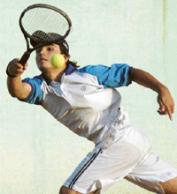 Paras of Chandigarh returns a forehand shot in a semifinal of the AITA Series against Abhay Raj in Chandigarh on Wednesday.