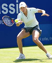 Alicia Molik of Australia hits a forehand return during her match against Laura Granville of the USA in the second round of the Edgbaston grasscourt championships near Birmingham on Wednesday