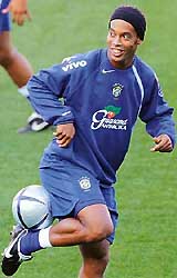 Brazilian soccer star Ronaldinho smiles during a team practice session ahead of their World Cup qualifying match against Argentina