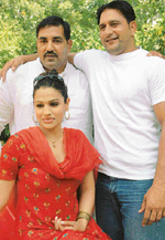 Arjuna awardee wrestler Jagdish Bhola (standing left) and Bharat Kesari wrestler Parminder Doomchheeri with Ruchi, who play lead roles in a Punjabi film Rustam-e-Hind at the Chandigarh Press Club on Thursday. 