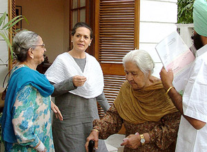 Beant Kaur (right), widow of Air Vice-Marshal Harjinder Singh, and her younger sister Satwant Kaur after presenting a cheque for Rs 1 crore to Congress President Sonia Gandhi for the Rajiv Gandhi Foundation in New Delhi on Thursday. 