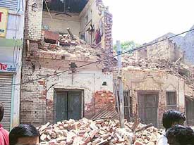 A view of the building that collapsed on a rickshaw carrying schoolchildren in Karnal on Thursday. 