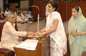 Tosham MLA Ms Kiran Chaudhry being congratulated by Haryana Chief Minister Bhupinder Singh Hooda after she was sworn in in the Haryana Vidhan Sabha, Chandigarh, on Thursday. 