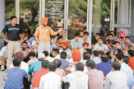 A PAUSA leader addresses protesting students on the PAU campus in Ludhiana on Thursday