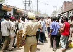 The police disperses a mob in Rajiv Gandhi Colony during a demolition drive in Ludhiana on Friday.