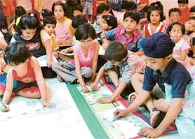 Students of Whizkid Playway’s Creche ’N Toddlers Club take part in a painting