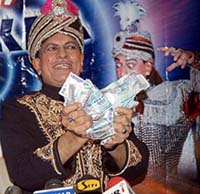Magician Samrat Shankar displays magical skills before mediapersons in Amritsar on Friday.