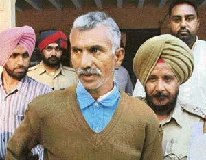 Darbara Singh being taken to the police lines in Jalandhar