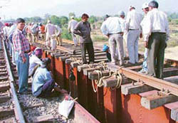 Railway officials inspect the new bridge between Chandi Mandir and Kalka