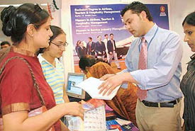 Participants get information at the 18th International Education and Career Fair