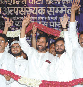 Lok Janshakti Party chief Ram Vilas Paswan with other members being felicitated at a national convention of Delhi Pradesh LJP Minority Cell in the Capital on Saturday 
