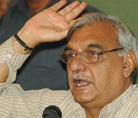 Haryana Chief Minister Bhupinder Singh Hooda addresses a press conference at the Chandigarh Press Club