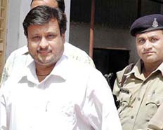 Shobhan Mehta arrives at the crime branch office in Ahmedabad on Saturday.
