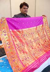 Shamim, a sari maker from Maharashtra, shows a dazzling silver sari costing Rs 2 lakh at the Craft Bazar organised by the Shimla District Rural Development Society. 