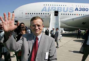 Pilot Jacques Rosay of France waves to Airbus-380 staff after the arrival of the 555-passenger superjumbo twin-deck aircraft on the eve of the official opening of the Paris Air Show at Le Bourget, north of Paris, on Sunday. 