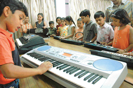 Children learn music at a summer workshop organised by Manav Mangal School, Sector 21, Chandigarh. 