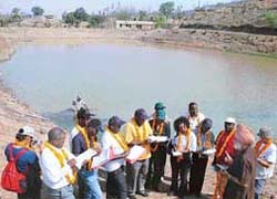Dr J.S. Samra, Deputy Director General of Indian Council of Agriculture Research, briefs experts and scientists from Central and East African countries about rainwater harvesting technology developed at Mandhala (Solan)