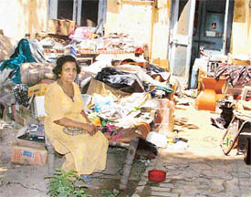 Ms Welseley sits with her belongings outside the room at the old courts complex in Ludhiana on Sunday