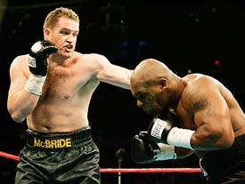 Irelands Kevin McBride punches former heavyweight champion Mike Tyson during their heavyweight title fight at the MCI Centre in Washington