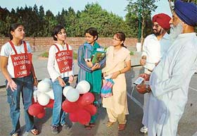 Children of St Stephens School distribute literature on blood donation to the visitors at Fragrance Garden, Sector-36, in Chandigarh