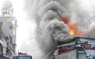 Smoke billows from shops which caught fire in Ludhianas Chaura Bazar on Monday