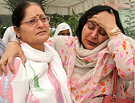 Family members of victims of the Uphaar fire tragedy at a function to pay homage on the eighth anniversary of the tragedy, at Uphaar Cinema in New Delhi on Monday.