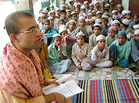 To promote communal harmony, the general secretary of the All-India Shree Chetanya Jan Kalyan Mission, Mr Krishan Murari Tripathi, addresses Muslim children at Jama Masjid in Amritsar on Monday.
