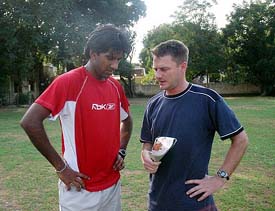 Indian team physio John Gloster talks to pace bowler Laxmipathy Balaji at the MRF Academy in Chennai on Monday