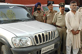 Kingpin of a vehicle thieves gang Bhim Singh Dhanak in custody at Sector 26 police station in Chandigarh on Tuesday.