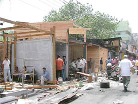 Rebuilding work goes on in Chaura Bazaar after a fire incident, in Ludhiana 