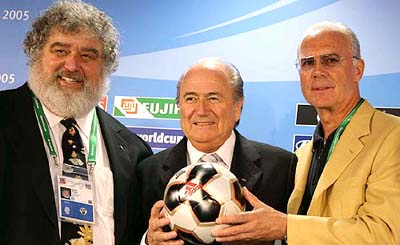 FIFA President Sepp Blatter, chairman of local organising committee Franz Beckenbauer and FIFA Confederations Cup chairman Chuck Blazer present the official match ball at a press conference in Frankfurt on Monday