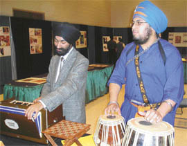 Divine melody: US-born Harjas Singh (right) and Sameep Singh (left) perform kirtan during Sikh Exhibition, 2005, held at Wright State University, Ohio, USA.