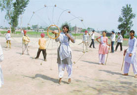 Students of Government School, Maloo Nangal, spruce up their martial-arts skills during a summer camp. 