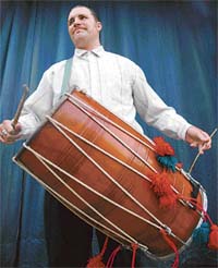 Gibb Schreffler, an American scholar, shows his skills in dhol at the Panjab Kala Bhavan in Chandigarh on Tuesday.