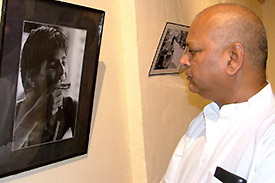 Union Minister of Food Processing Subodh Kant Sahai looking at a photograph in an exhibition on child labour, organised by Bachpan Bachao Andolan, in the Capital on Wednesday