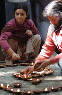 Kashmiri Hindu devotees light oil lamps during the annual puja at the Kheer Bhawani temple at Tullamula