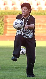 Diego Maradona balances a ball at the Rad Star stadium in Belgrade on Tuesday