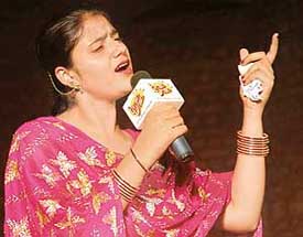 A contestant participates in a Punjabi folk song competition held at Kalagram in Chandigarh