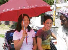  A rickshaw ride is all right if a parasol is at hand to keep away the harsh rays of the sun