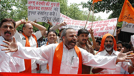 Activists of the Shiv Sena raise slogans against the Jammu and Kashmir and UPA Governments during a protest at Jantar Mantar in New Delhi on Friday