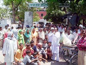 Residents of Jangala village protest against the administration in front of the tehsil office in Pathankot on Friday.